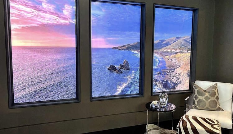 4K virtual window display showing a high-resolution mountain landscape in a London home.