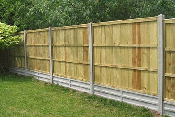 a fenced in area with a fenced in area with a tree