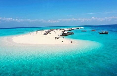 A stunning aerial view of Nakupenda Sandbank in Zanzibar, Tanzania, showcasing pristine white sand, turquoise waters