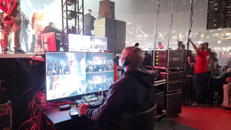 A video switcher at a multi-screen console.