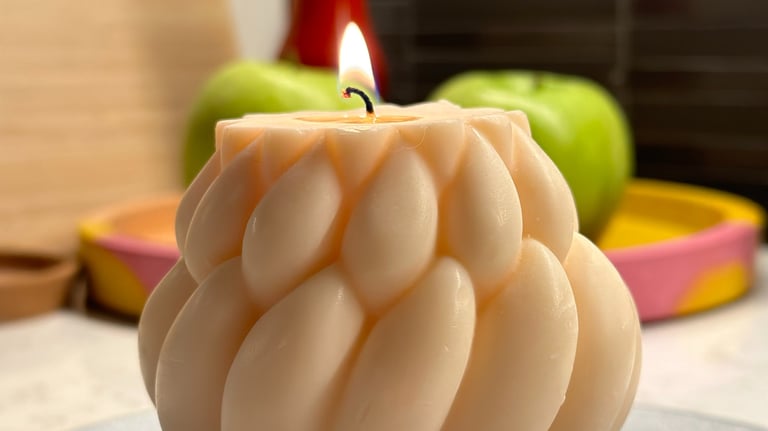 White knitted candle and apples