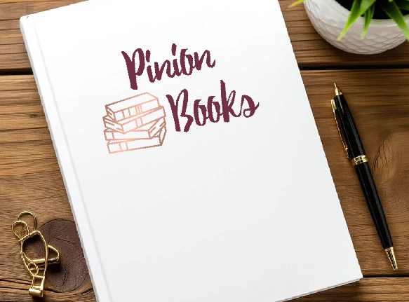 book cover that reads pinion books laying on a table.