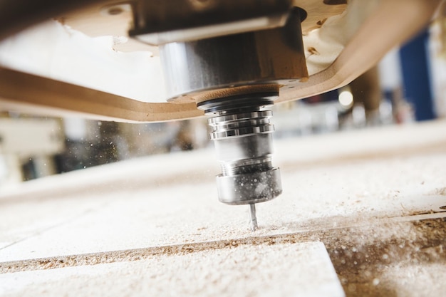 a cnc drilling a piece of wood