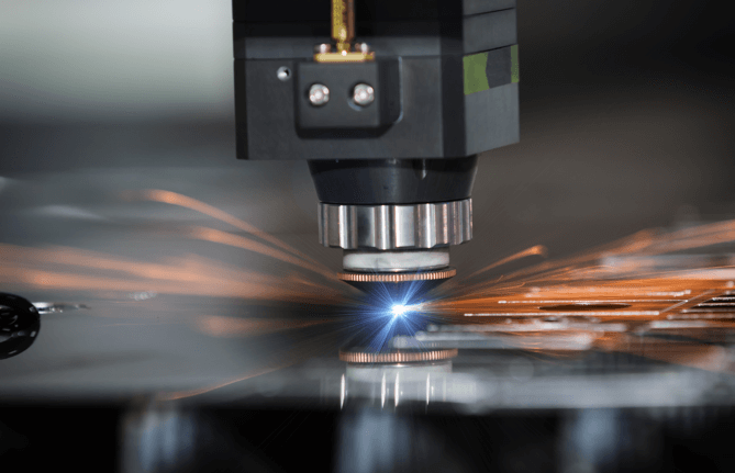laser machine cutting through a piece of material