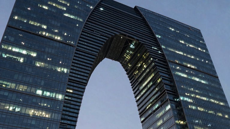 A modern abstract architectural structure bridging two high-rise corporate towers under a dramatic evening sky, sleek steel and glass materials glowing with teal lights, representing global connection and technical infrastructure.