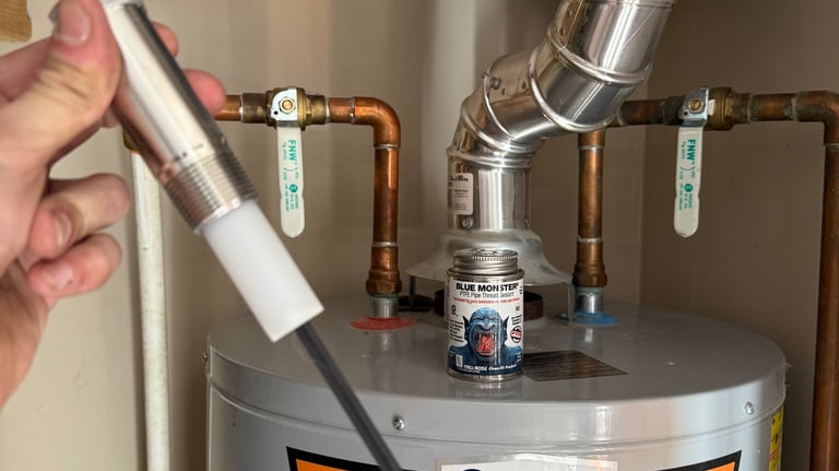 Water heater maintenance by Cherry Home Service – inspecting anode rod and plumbing setup in Glenwoo