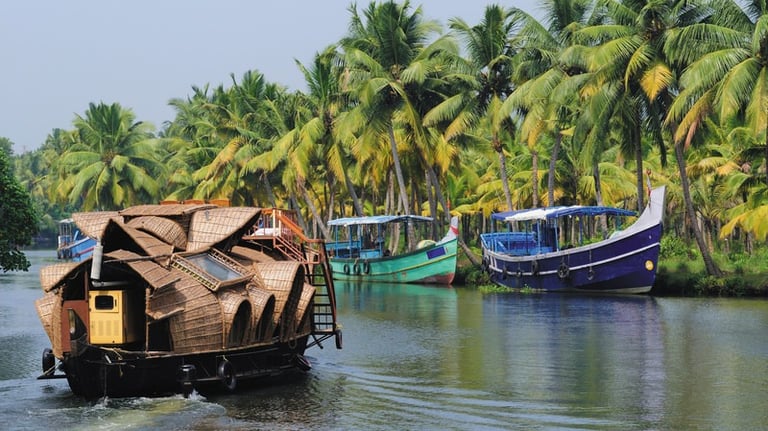 Kerala backwaters houseboat surrounded by lush greenery ideal LTC tour destination in India