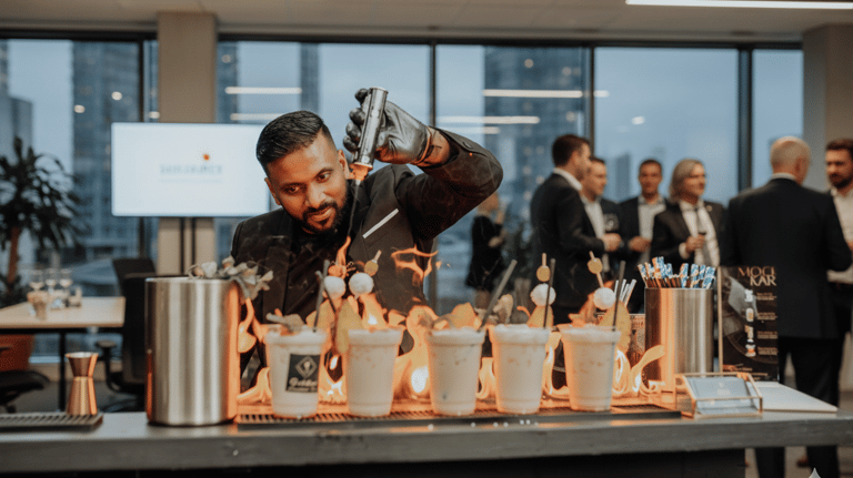 Professional bartender uses a blowtorch to create flaming cocktails at a corporate event bar.