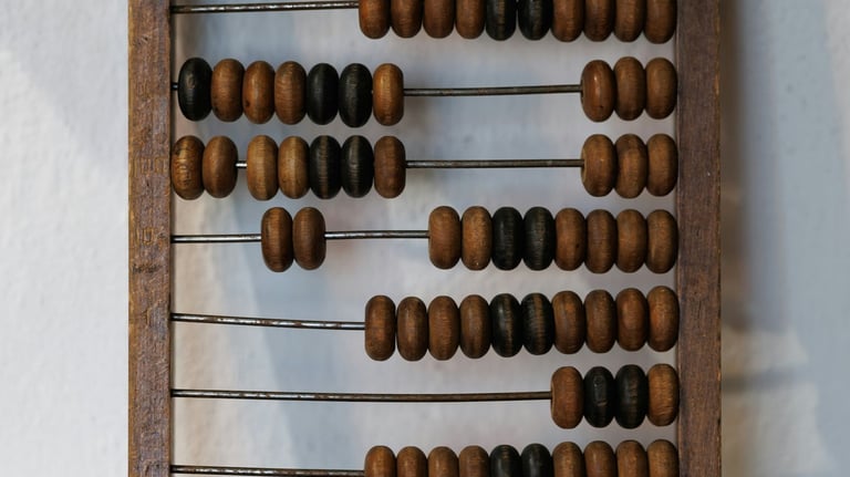 Photo of a large wooden abacus. Credit Alexandr Popadin via Unsplash.