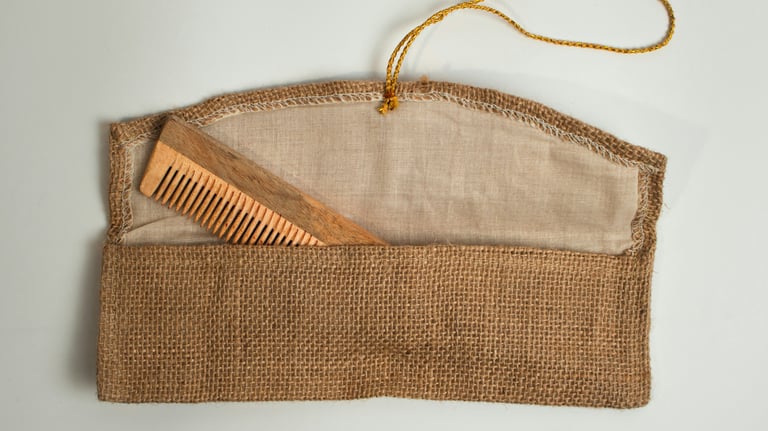 Photo of a wooden comb in a burlap purse. Credit Raghavendra V. Konkathi via Unsplash.