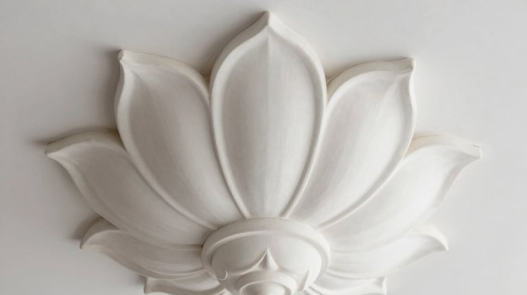 Elegant white gypsum ceiling ornament with a minimalist lotus design, photographed from below against a clean white ceiling, soft studio lighting.