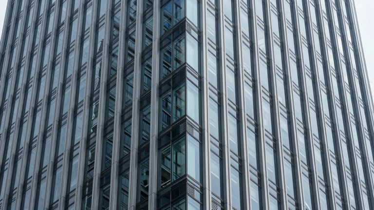 A minimalist, structured view of a glass and steel skyscraper, highlighting clean lines and architectural sophistication. Global / High-end corporate.