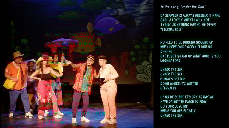 Musical theatre actors perform a parody of Under the Sea on stage with colorful costumes