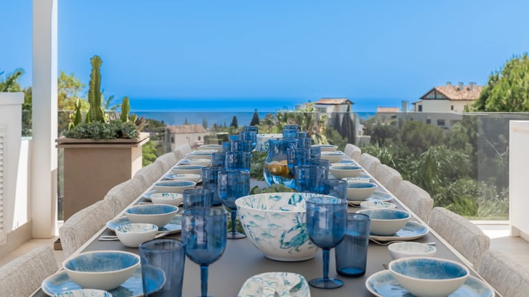 Rooftop dining terrace with ocean backdrop at Villa Serenity