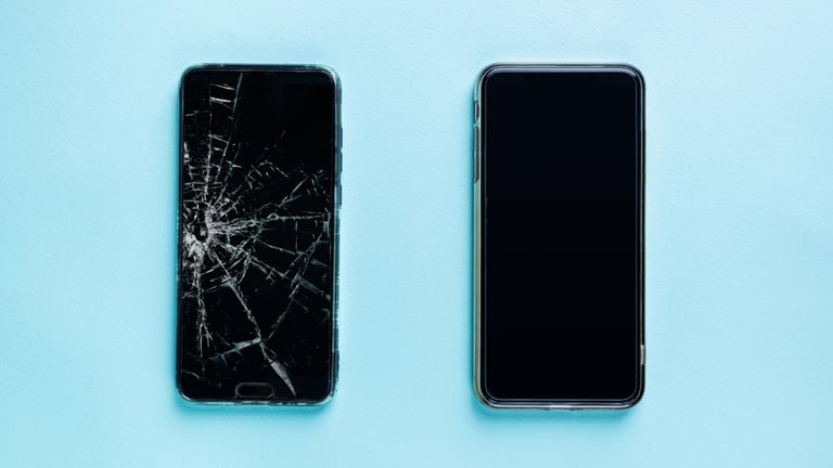 a couple of cell phones with a broken screen