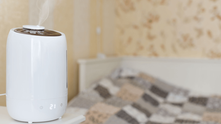 a white humider sitting on top of a bed