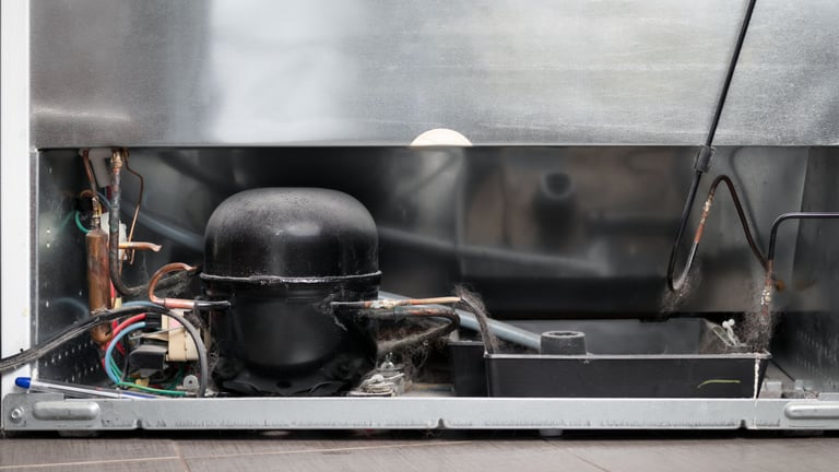 a refrigerator with a large metal container inside