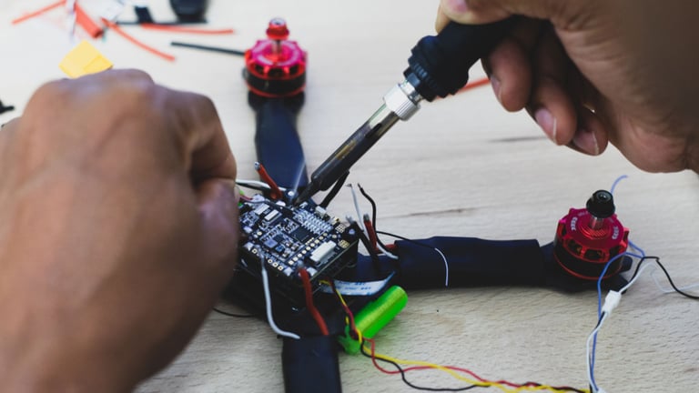 a person is working on a small device