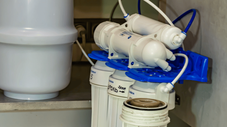 a water filtrator with a blue plastic container