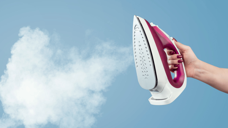 a person holding a steam iron iron iron iron iron iron iron iron iron iron iron