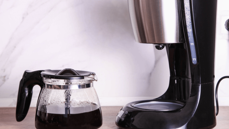 a coffee maker with a coffee potted on a counter