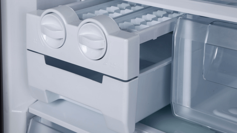 a refrigerator with a refrigerator door open and a drawer with a drawer with a drawer