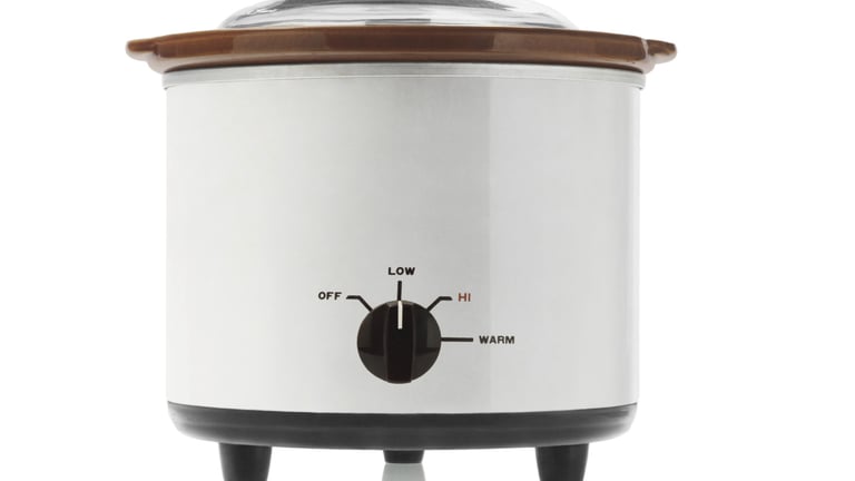 a crock pot with a lid on a crock pot