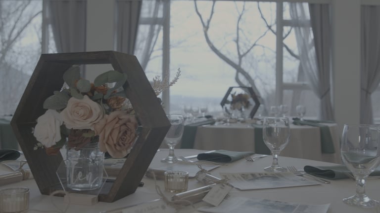 Ungraded picture of a table with a vase of flowers and wine glasses