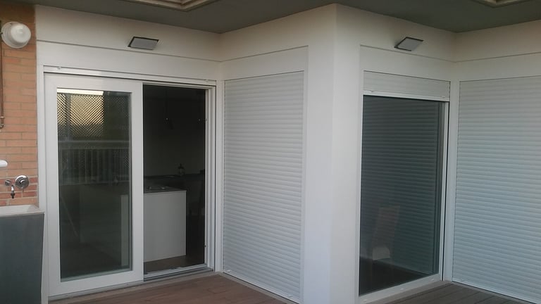 Correderas-Elevables de PVC para salida a terraza atico.