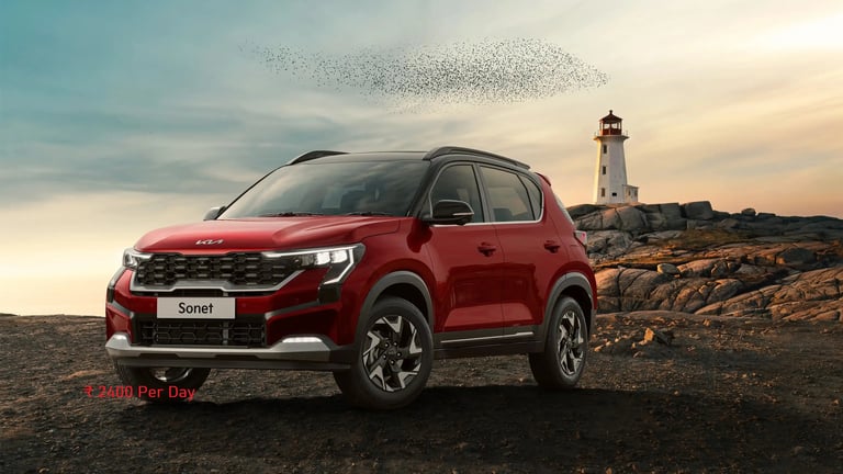 a red suv kia sonet parked on a rocky beach