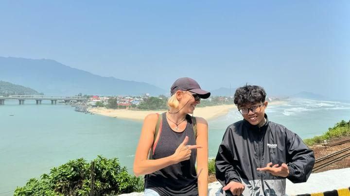 Happy customer with her local guide on a motorbike tour in Da Nang.