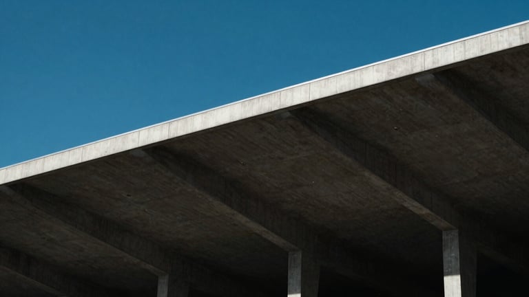 Architectural close-up of a modern concrete stadium roof against a crisp blue sky, dramatic natural light, high contrast, minimalist editorial sports photography.