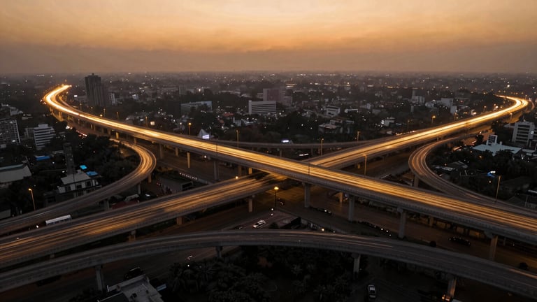 Aerial wide-angle view of a massive multi-level highway interchange in India during golden hour, with glowing saffron and gold digital twin vector lines tracing the lanes, high-contrast architectural lighting