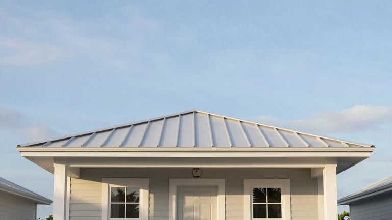 Straight-on architectural elevation of a modern coastal cottage with a clean metal roof under a soft sky-blue Florida sky, bright natural daylight, 35mm