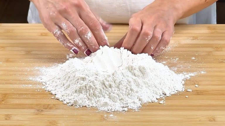 Make a well with the flour