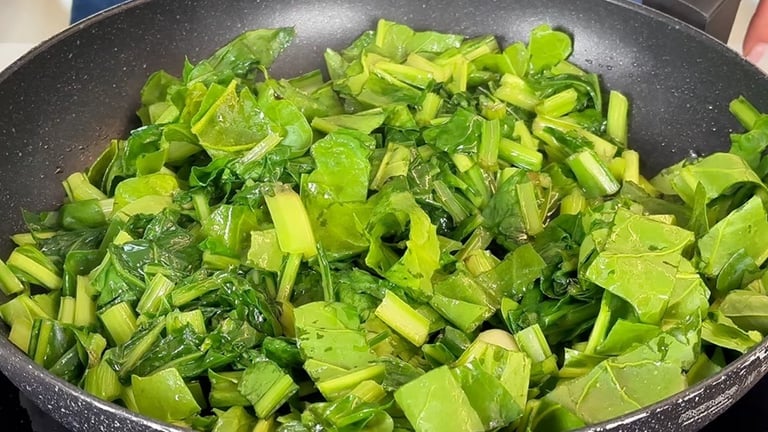 Sauté the greens for a few minutes