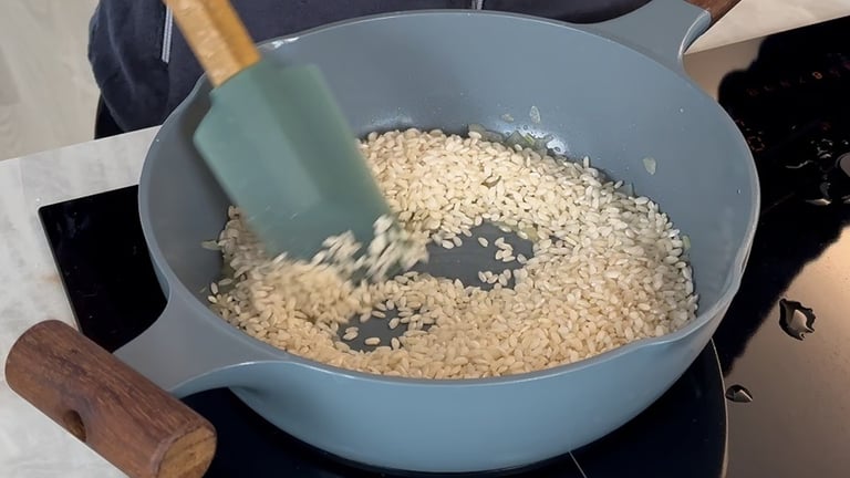 Toast the rice over medium heat for a few minutes, stirring constantly