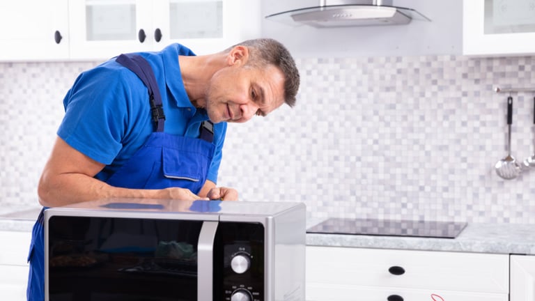 a man in a blue shirt and blue overall overall overall overall overall overall overall overall