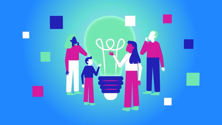 a group of people standing around a light bulb