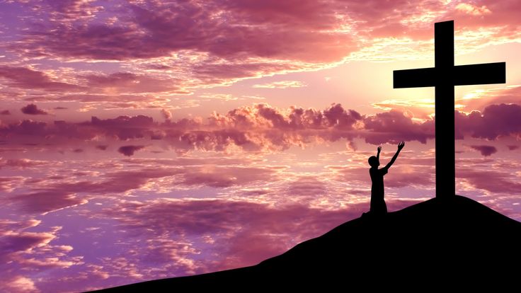 kid beneath the cross
