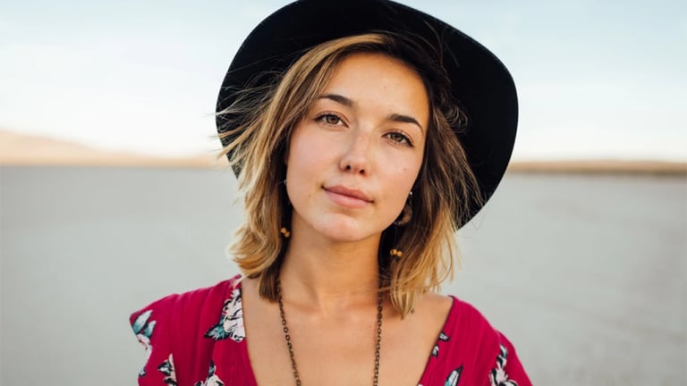 a woman in a red dress and hat Martin PE / COACH