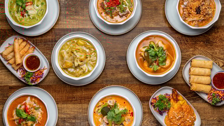 Thai Yellow, Red and Green Curries and chicken satay skewers.