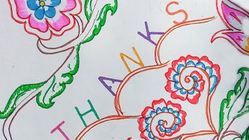 Hand-drawn colourful card with the word Thanks on it.