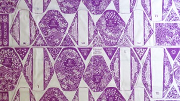 Length of fabric showing grid for printing reusable sanitary napkins