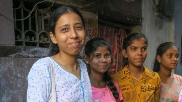 Pooa with three girls.