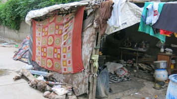 Slum dwelling on roadside.