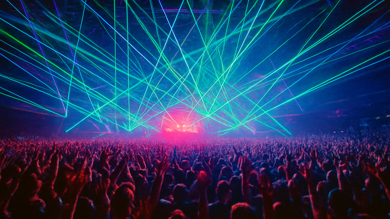 Massive indoor festival arena, complex laser arrays, thousands of hands raised, ecstatic crowd