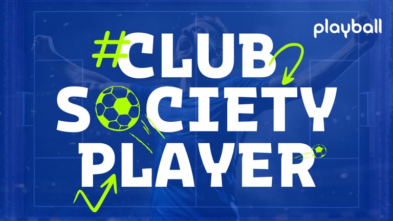 a man in a blue shirt is holding a soccer ball