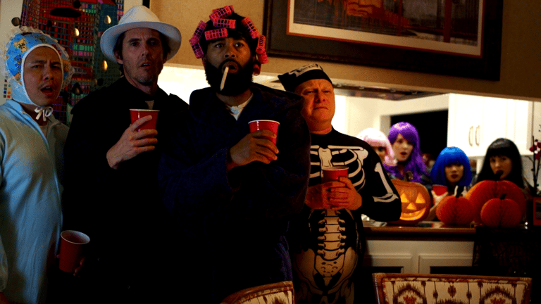 All Hallows' Steve - Full cast in costumes reacting in shock at Halloween party climax.