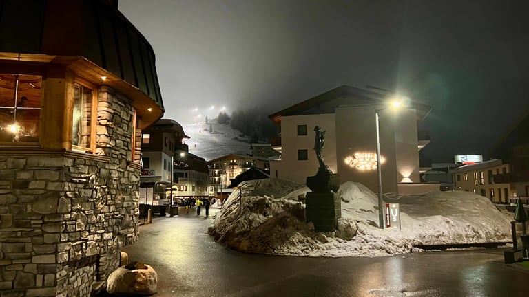 obergurgl town at night with a ski resort behind it